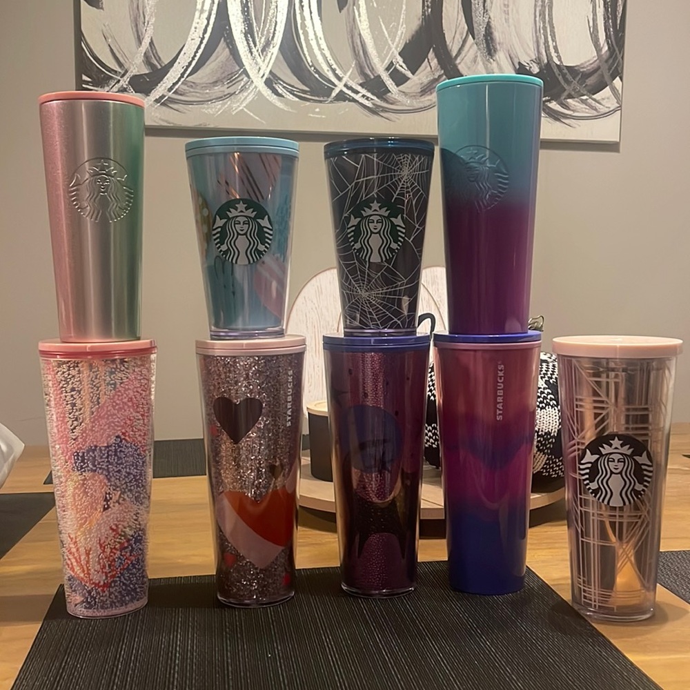 Starbucks cups!! Most are brand new!! Some with receipts still in cup!